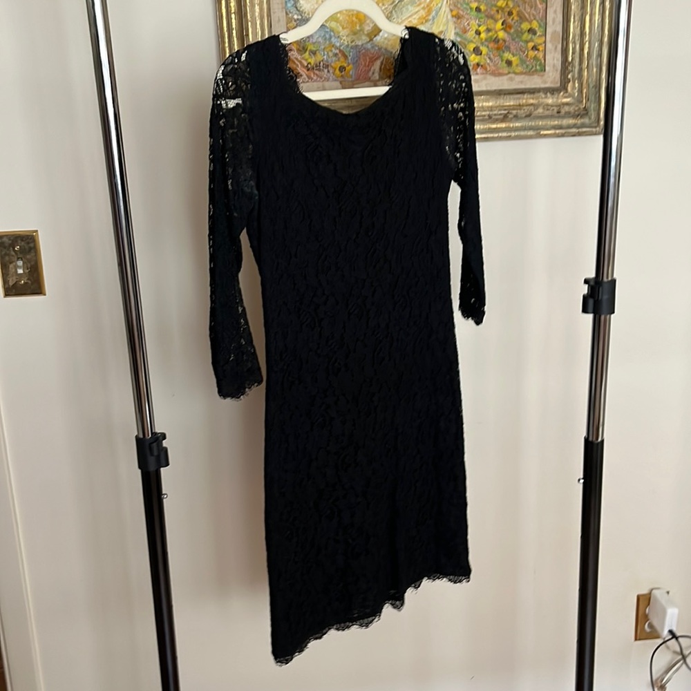 Black lace Diane von Furstenburg short dress with long sleeves.